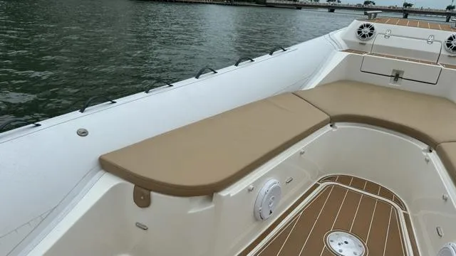 Hoko Yacht Photos Pics 2017 Nuova Jolly Princess boat interior with tan seating and wood accents on water.