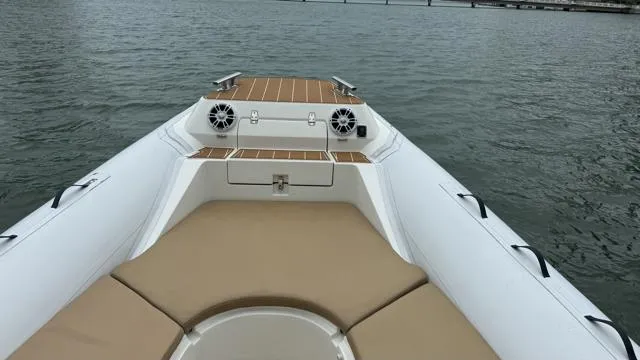 Hoko Yacht Photos Pics 2017 Nuova Jolly Princess boat with beige seating on calm water.