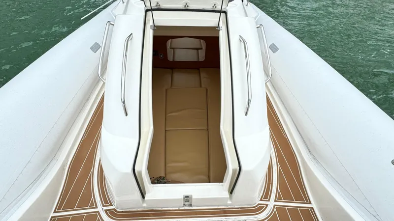 Hoko Yacht Photos Pics 2017 Nuova Jolly Princess boat interior with open hatch and teak flooring.