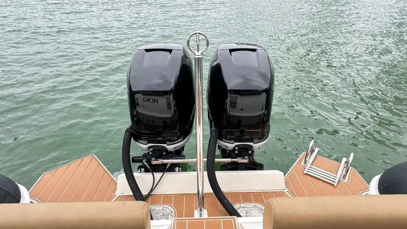 Hoko Yacht Photos Pics 2017 Nuova Jolly Princess boat with dual outboard motors on water.