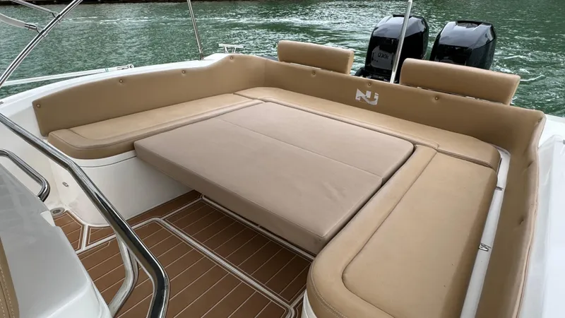 Hoko Yacht Photos Pics 2017 Nuova Jolly Princess boat with spacious beige seating area and twin engines.