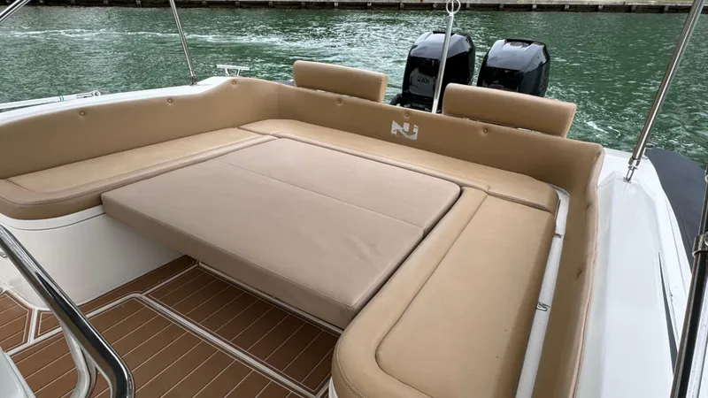 Hoko Yacht Photos Pics 2017 Nuova Jolly Princess boat with beige seating and twin engines on water.
