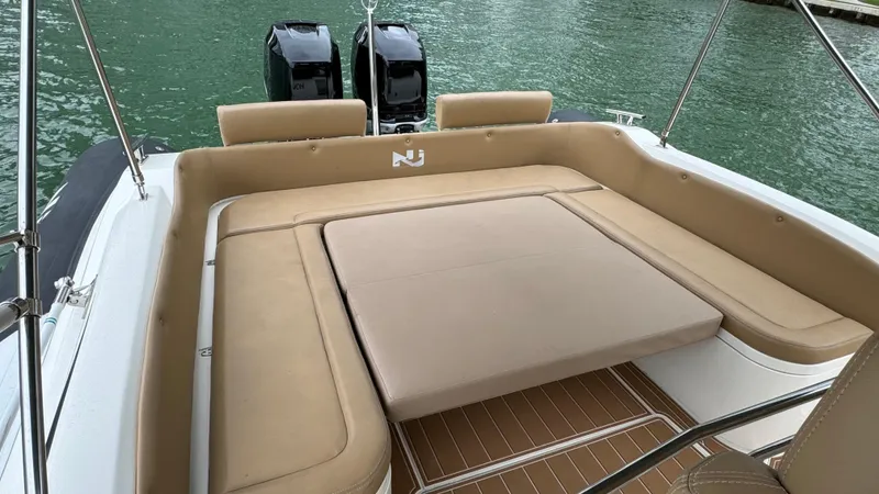 Hoko Yacht Photos Pics 2017 Nuova Jolly Princess boat with beige seating and dual outboard motors.
