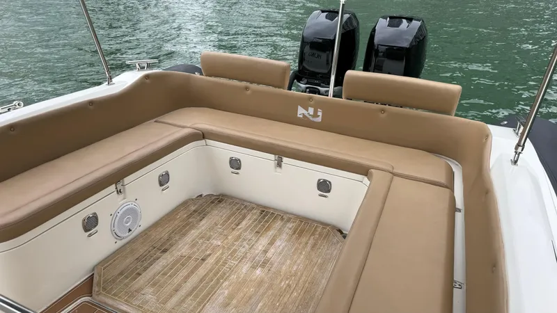 Hoko Yacht Photos Pics 2017 Nuova Jolly Princess boat interior with tan seating and twin engines.