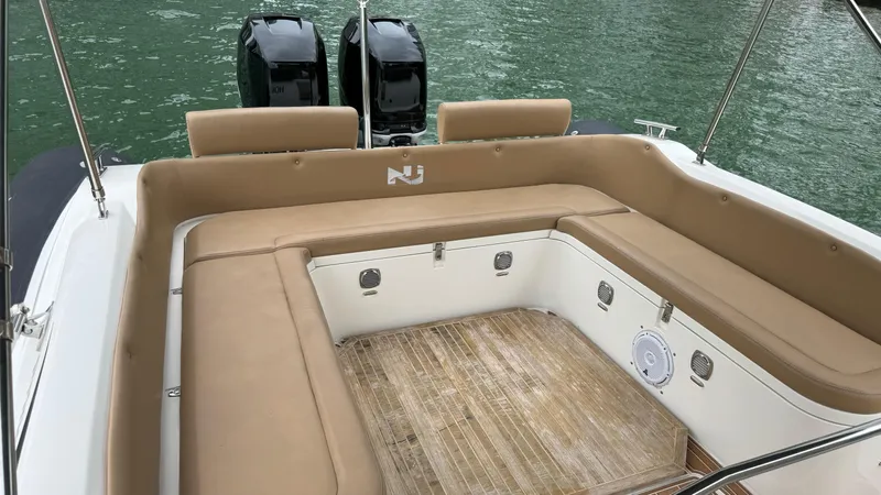 Hoko Yacht Photos Pics 2017 Nuova Jolly Princess boat with tan seating and dual outboard motors.