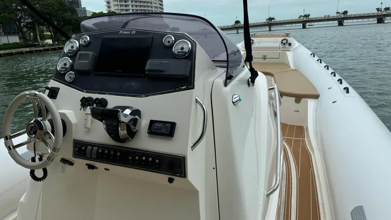 Hoko Yacht Photos Pics 2017 Nuova Jolly Princess boat with modern dashboard, steering wheel, and waterfront view.