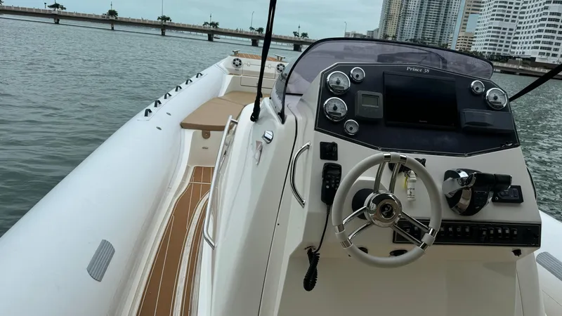 Hoko Yacht Photos Pics 2017 Nuova Jolly Princess boat interior with steering wheel and control panel on water.