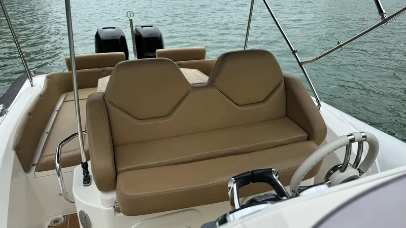 Hoko Yacht Photos Pics 2017 Nuova Jolly Princess boat interior with tan seating and dual engines.