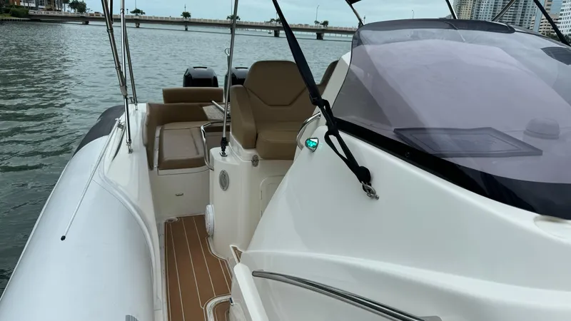 Hoko Yacht Photos Pics 2017 Nuova Jolly Princess boat with sleek design, docked on calm waters.