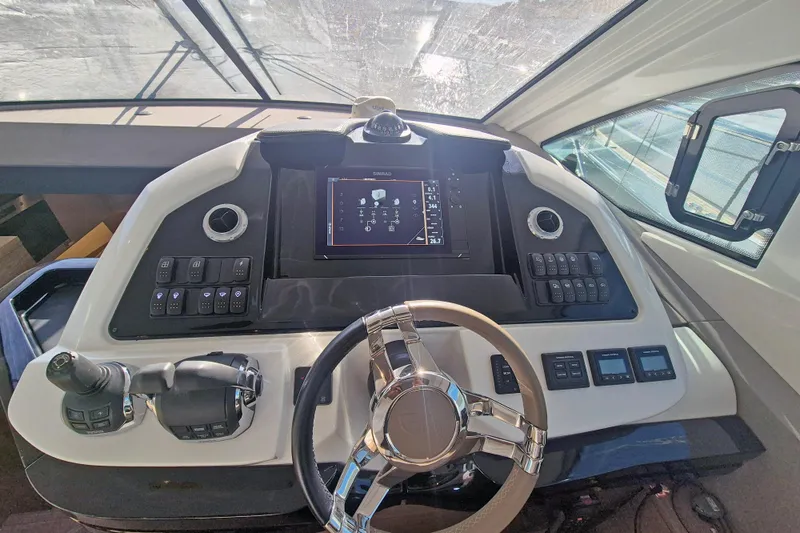  Yacht Photos Pics 2019 Beneteau Gran Turismo 50 Sportfly helm with modern controls and navigation display.