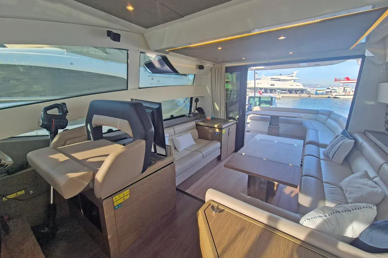  Yacht Photos Pics Luxurious interior of 2019 Beneteau Gran Turismo 50 Sportfly yacht with spacious seating.