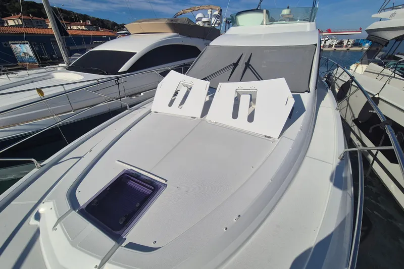  Yacht Photos Pics 2019 Beneteau Gran Turismo 50 Sportfly yacht docked at marina.