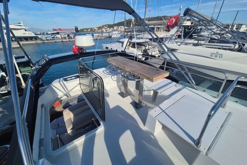  Yacht Photos Pics 2019 Beneteau Gran Turismo 50 Sportfly yacht at marina, featuring spacious deck and seating area.
