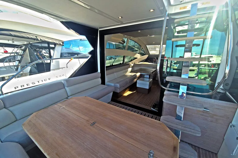  Yacht Photos Pics Luxurious interior of 2019 Beneteau Gran Turismo 50 Sportfly yacht with modern seating and staircase.