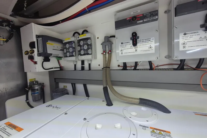  Yacht Photos Pics Electrical system of 2019 Beneteau Gran Turismo 50 Sportfly yacht, featuring control panels and wiring.