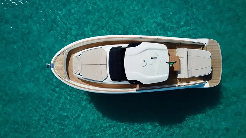  Yacht Photos Pics 2023 Solaris Power 44 Open yacht on clear turquoise water, aerial view.