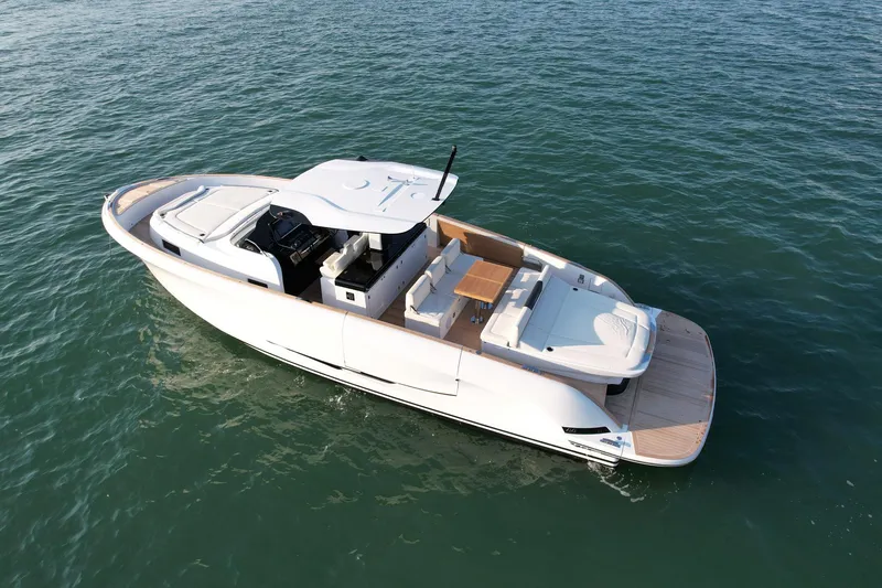  Yacht Photos Pics 2023 Solaris Power 44 Open yacht on calm water, showcasing sleek design and spacious deck.