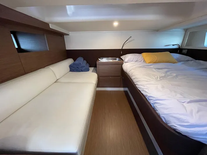  Yacht Photos Pics Luxurious cabin interior of 2023 Solaris Power 44 Open yacht with bed and sofa.