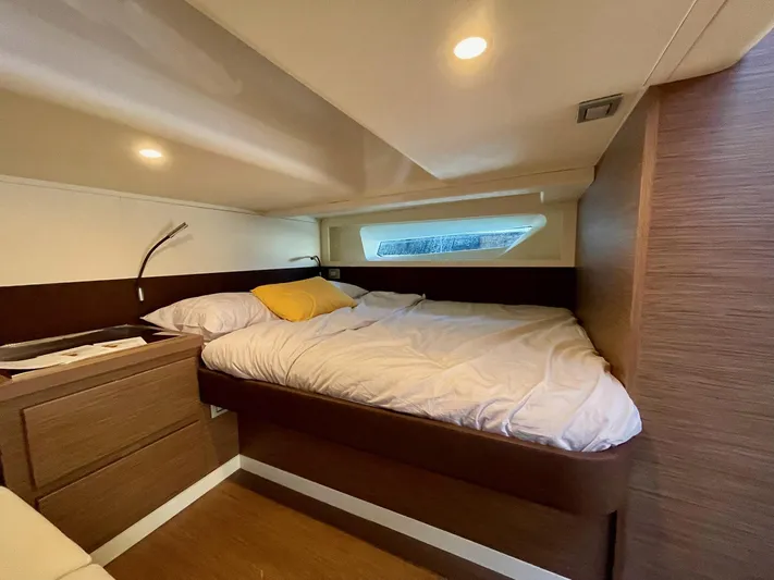  Yacht Photos Pics Luxurious cabin interior of 2023 Solaris Power 44 Open yacht with cozy bed and modern design.
