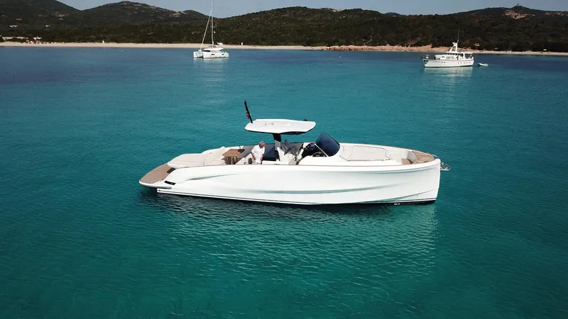  Yacht Photos Pics 2023 Solaris Power 44 Open yacht on clear blue water with scenic background.