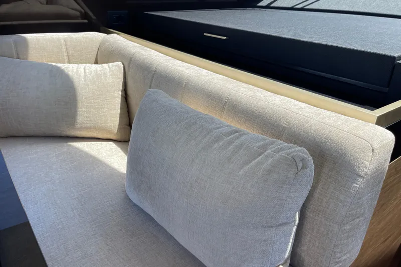  Yacht Photos Pics Luxurious beige seating in 2025 Ferretti Yachts 670 interior, showcasing modern design.