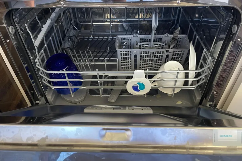  Yacht Photos Pics Open Siemens dishwasher with dishes and detergent pod inside.