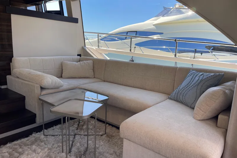  Yacht Photos Pics Luxurious interior of 2025 Ferretti Yachts 670 with plush seating and modern decor.