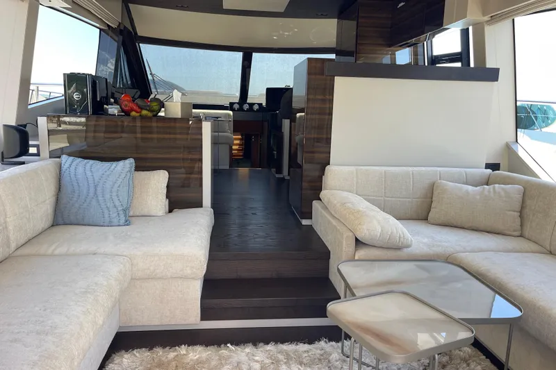  Yacht Photos Pics Luxurious interior of 2025 Ferretti Yachts 670 with elegant seating and modern design.