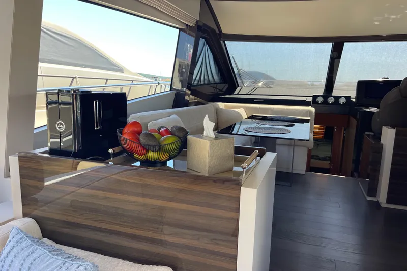  Yacht Photos Pics Luxurious interior of 2025 Ferretti Yachts 670 with modern decor and panoramic windows.