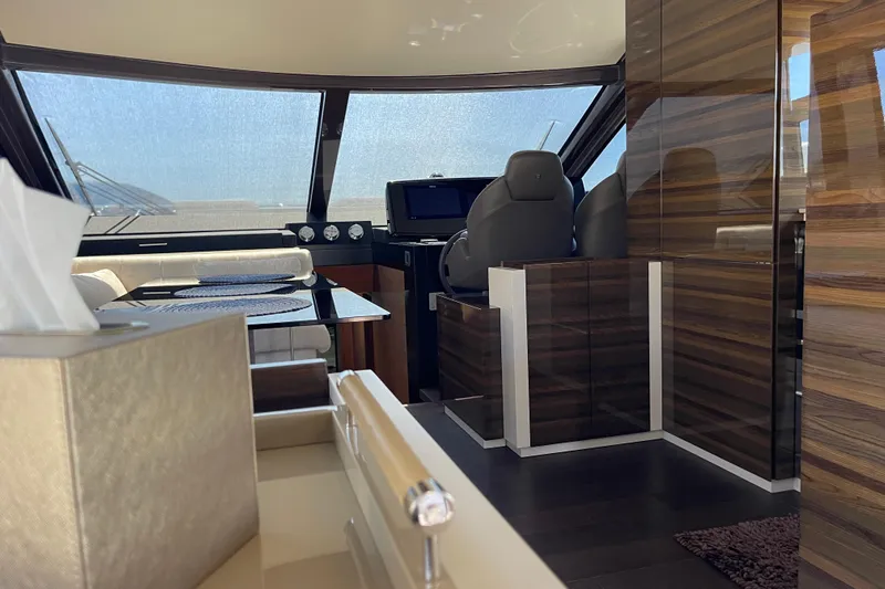  Yacht Photos Pics Luxurious interior of 2025 Ferretti Yachts 670 with modern design and elegant wood finishes.