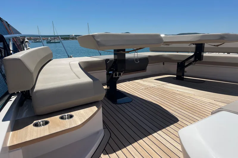  Yacht Photos Pics Luxurious 2025 Ferretti Yachts 670 with elegant deck seating and scenic ocean view.