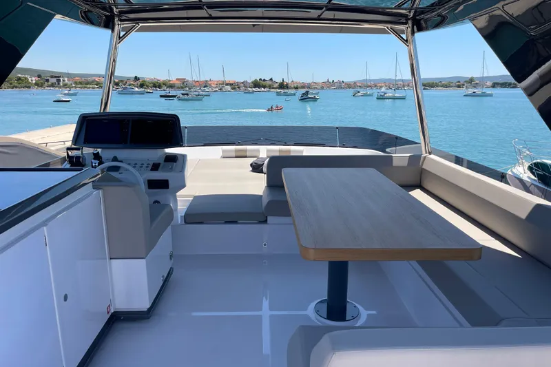  Yacht Photos Pics Luxurious 2025 Ferretti Yachts 670 with spacious deck overlooking serene marina.