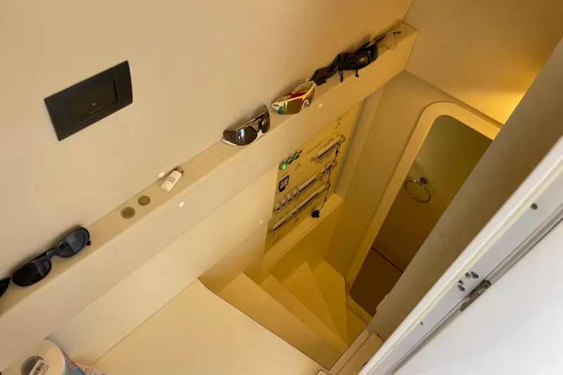  Yacht Photos Pics Interior view of 2025 Ferretti Yachts 670, featuring a staircase and control panel.