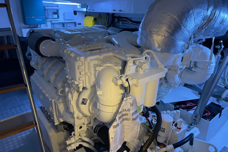  Yacht Photos Pics Engine room of 2025 Ferretti Yachts 670, showcasing advanced marine engine components.