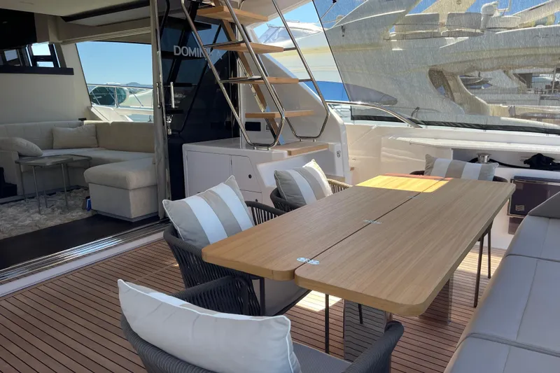  Yacht Photos Pics Luxurious 2025 Ferretti Yachts 670 interior with elegant seating and dining area.