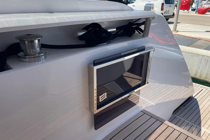  Yacht Photos Pics 2025 Ferretti Yachts 670, sleek deck design with modern features, docked at marina.