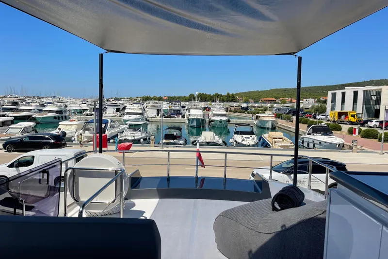  Yacht Photos Pics View from 2025 Ferretti Yachts 670, overlooking marina with numerous boats docked.