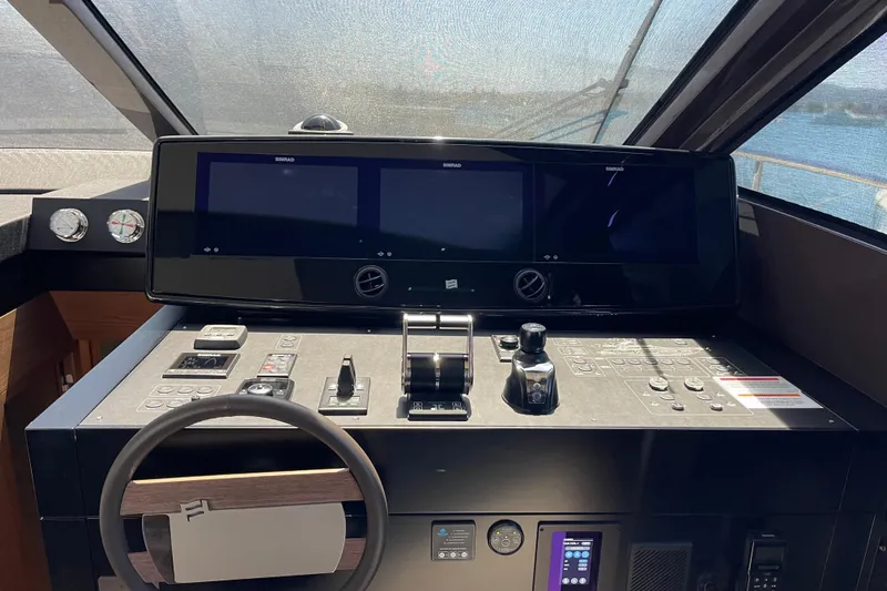  Yacht Photos Pics Helm of 2025 Ferretti Yachts 670 with advanced navigation displays and controls.