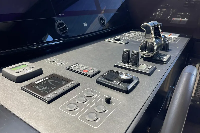  Yacht Photos Pics Control panel of 2025 Ferretti Yachts 670, featuring advanced navigation and throttle systems.