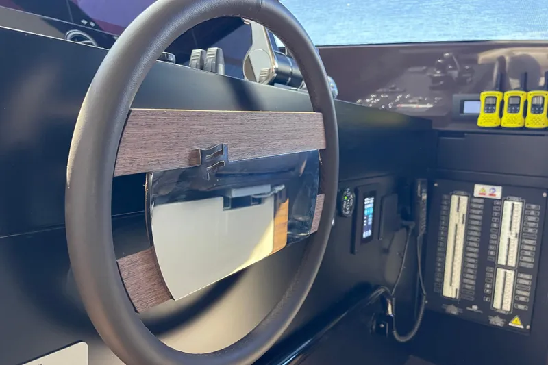  Yacht Photos Pics Steering wheel and control panel of 2025 Ferretti Yachts 670.