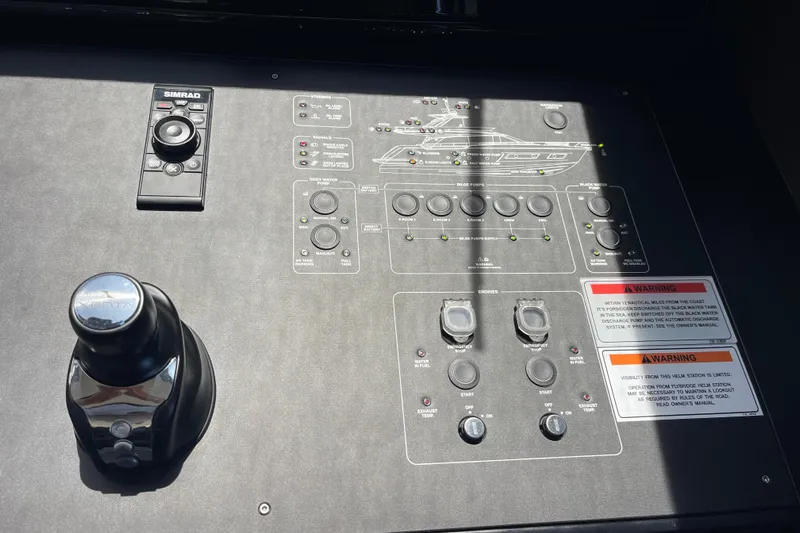  Yacht Photos Pics Control panel of 2025 Ferretti Yachts 670 with navigation and engine controls.