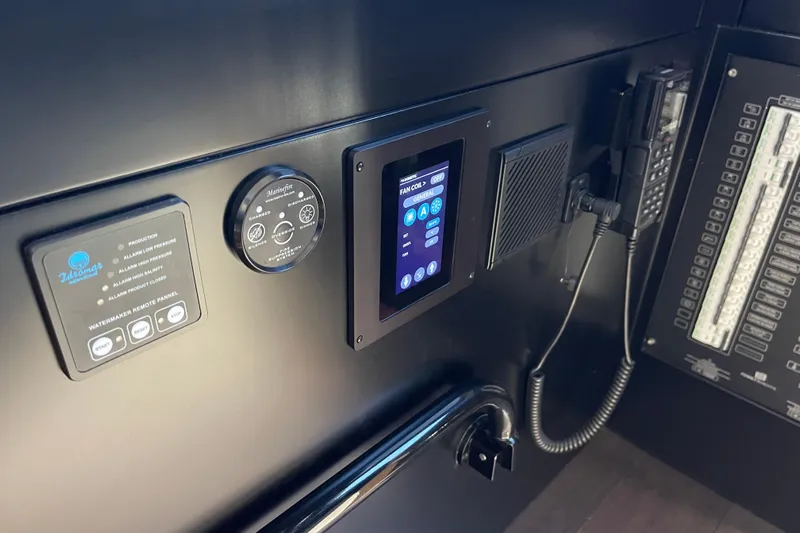  Yacht Photos Pics Control panel of 2025 Ferretti Yachts 670 with digital display and communication devices.