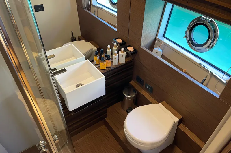  Yacht Photos Pics Luxurious bathroom in 2025 Ferretti Yachts 670, featuring modern fixtures and ocean view.