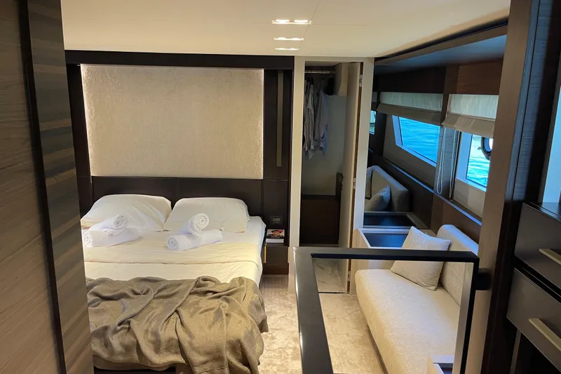  Yacht Photos Pics Luxurious interior of 2025 Ferretti Yachts 670, featuring elegant bedroom and seating area.