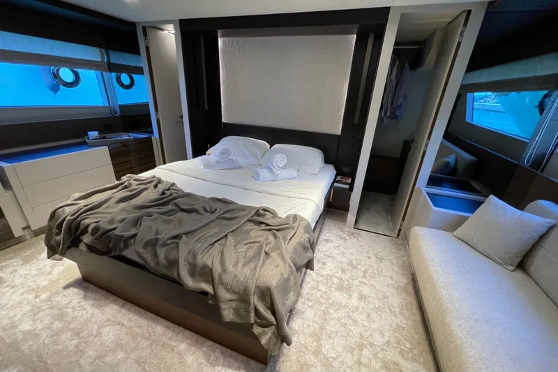  Yacht Photos Pics Luxurious bedroom interior of 2025 Ferretti Yachts 670, featuring elegant design and comfort.