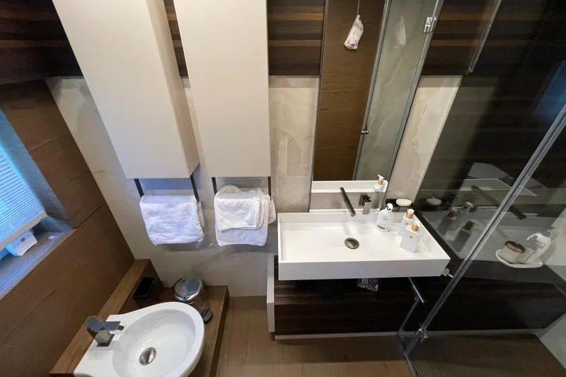 Yacht Photos Pics Luxurious bathroom in 2025 Ferretti Yachts 670, featuring modern sink and elegant design.