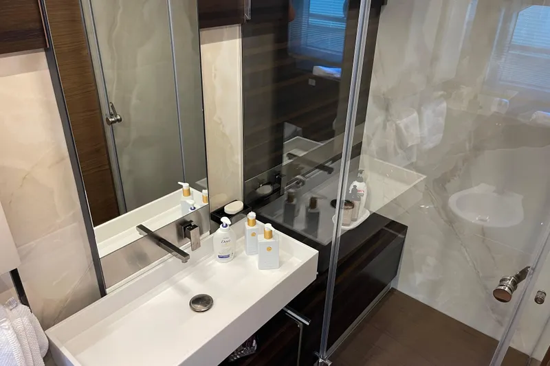  Yacht Photos Pics Luxurious bathroom in 2025 Ferretti Yachts 670, featuring modern fixtures and elegant design.
