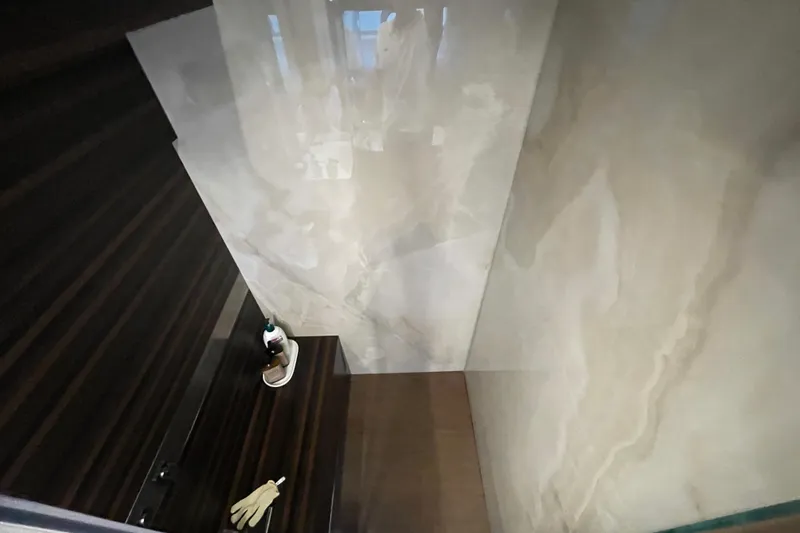  Yacht Photos Pics Luxurious interior of 2025 Ferretti Yachts 670, featuring elegant wood and marble finishes.