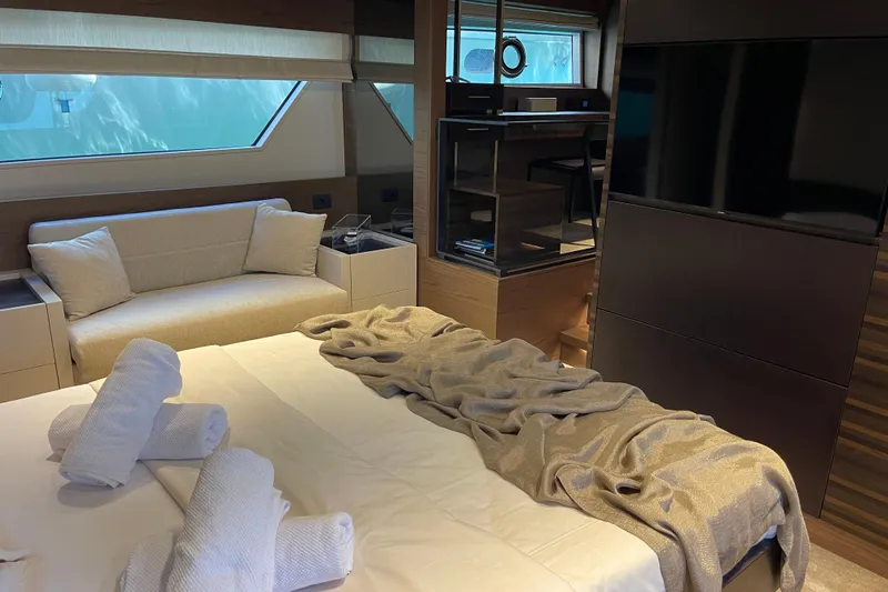  Yacht Photos Pics Luxurious interior of 2025 Ferretti Yachts 670 with elegant bedding and modern furnishings.