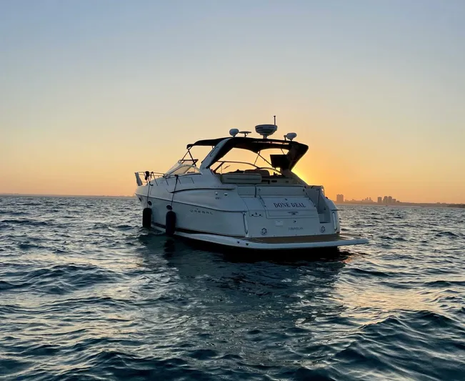  Yacht Photos Pics 2002 Regal 3860 Commodore yacht at sunset on open water.
